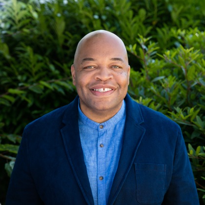 A headshot of Tides’ Director of Justice, Equity, Diversity & Inclusion Erwin Acox, Jr.