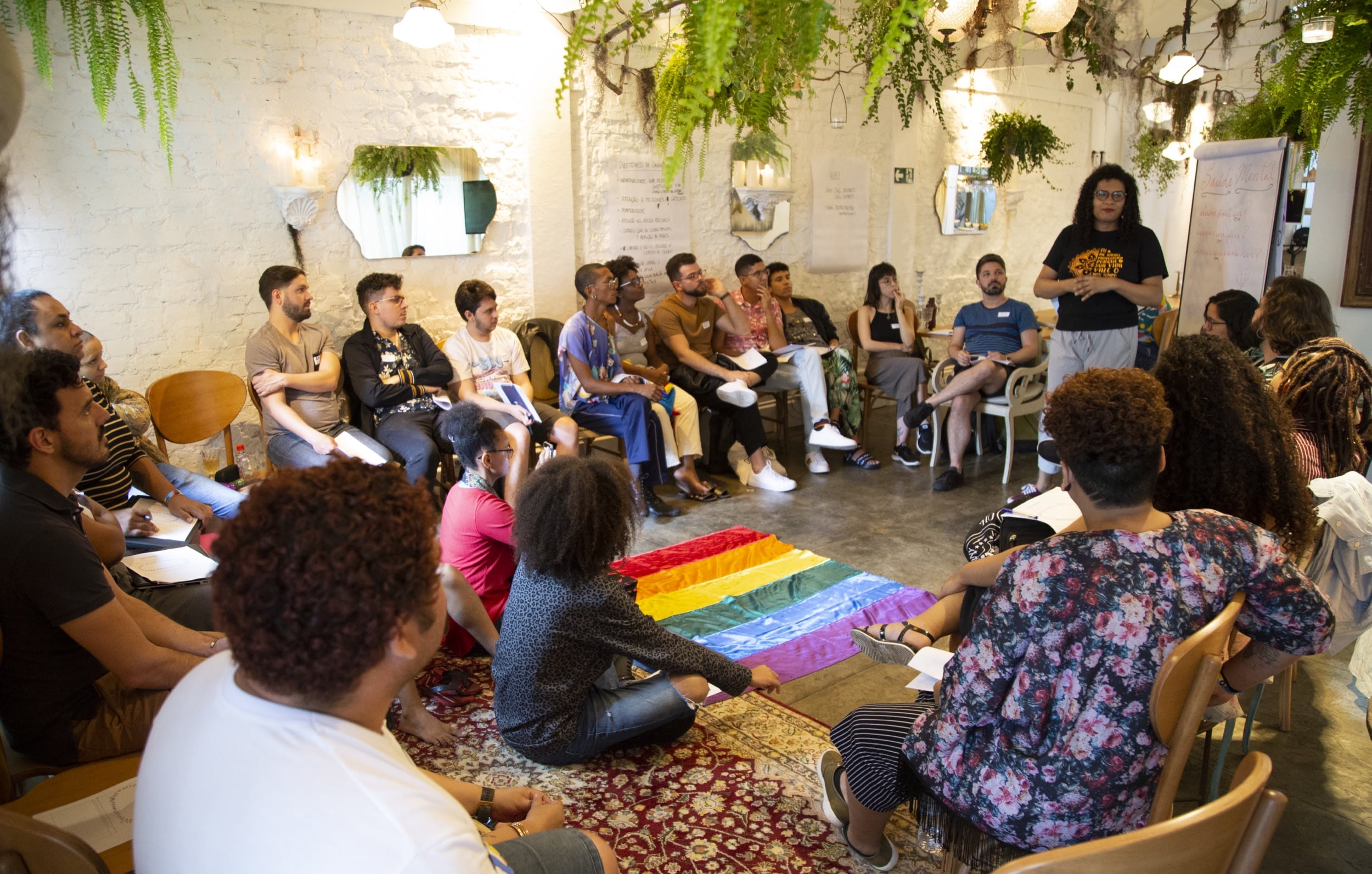 A group of multi-racial LGBTQ organizers having a meeting. 