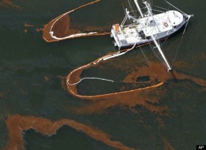 A shrimp boat drags booms to gather oil in the waters of Chandeleur Sound, Louisiana, on May 5.