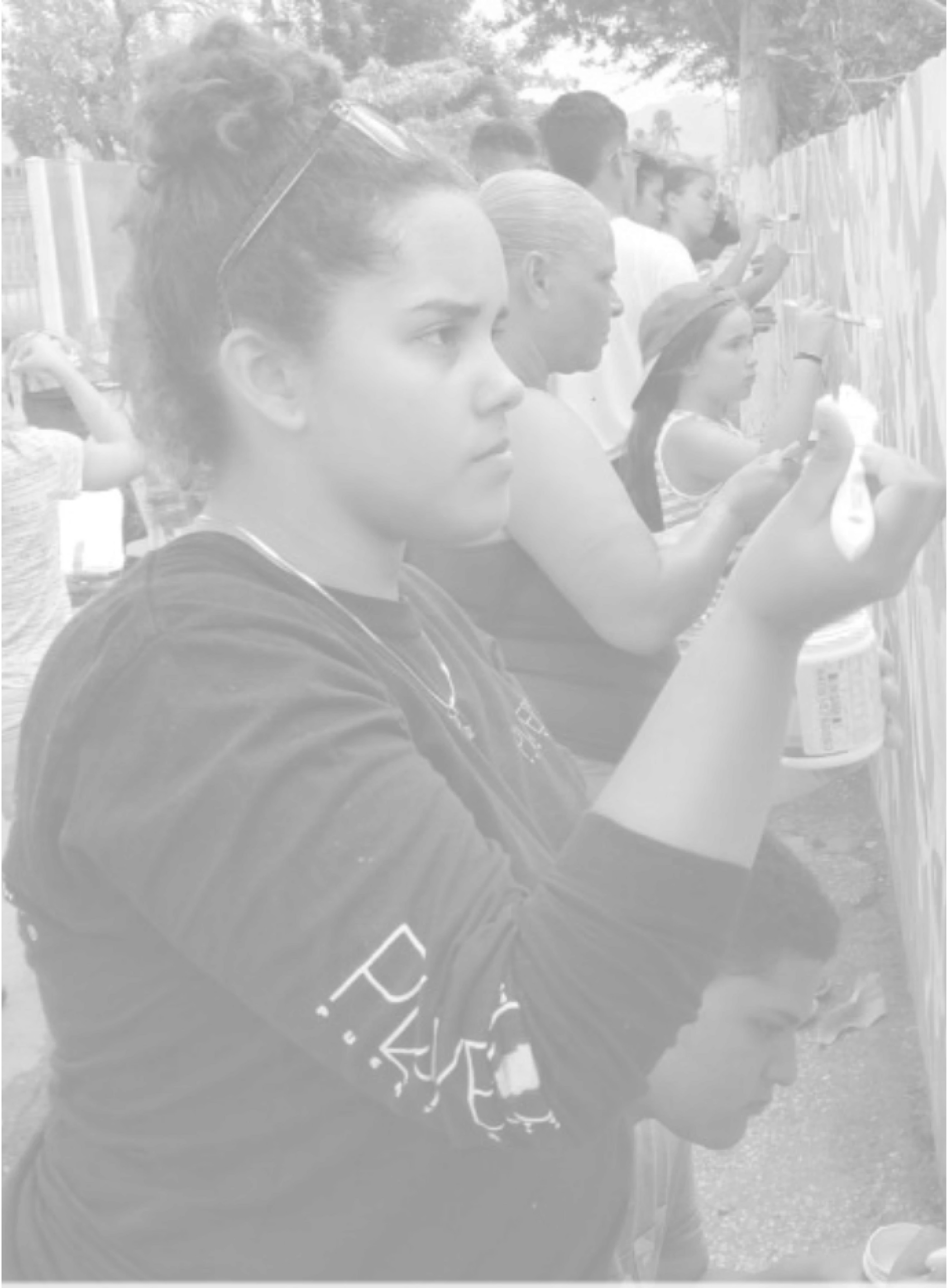 Person painting on wall
