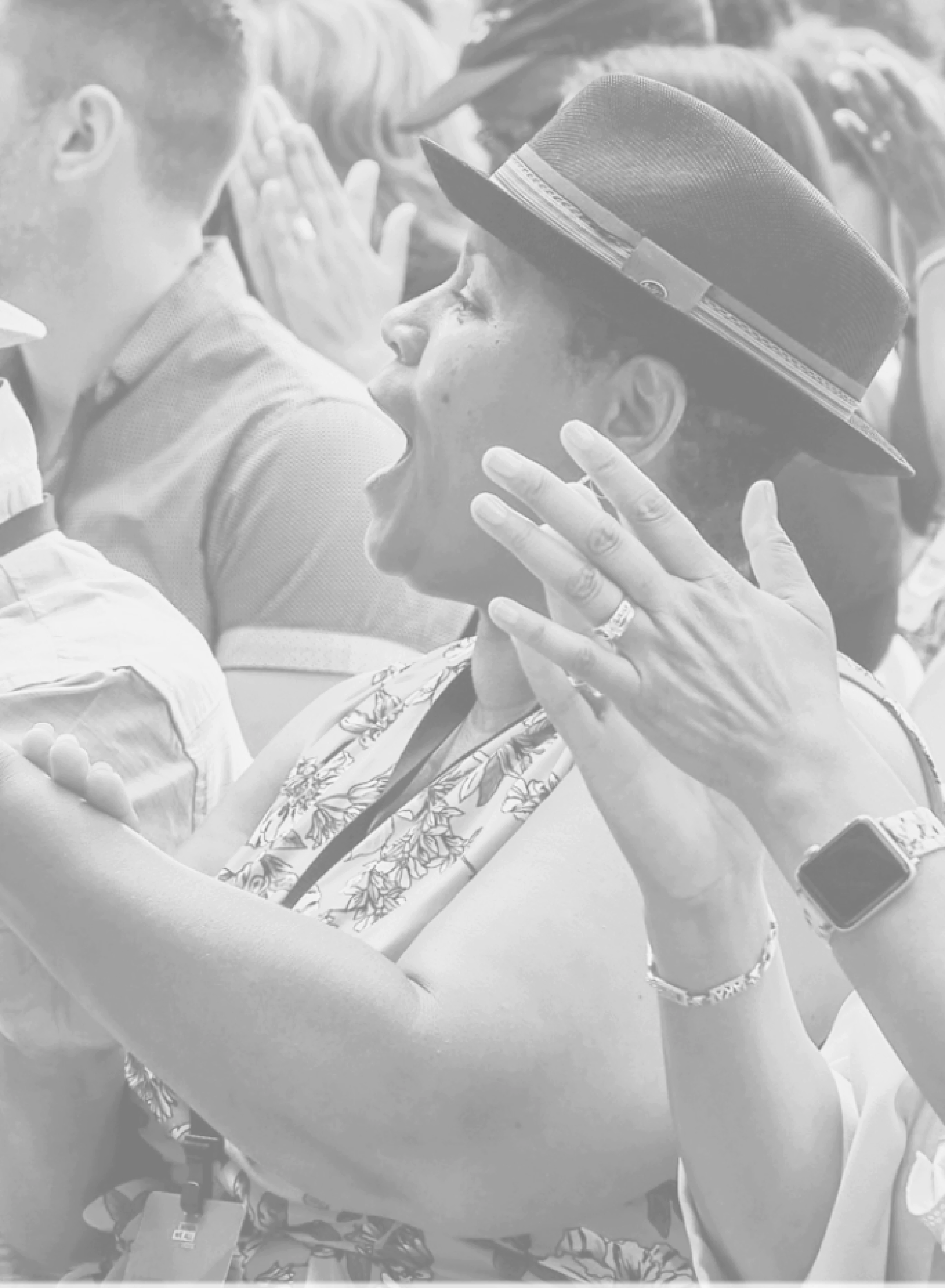 black and white cropped image of people clapping