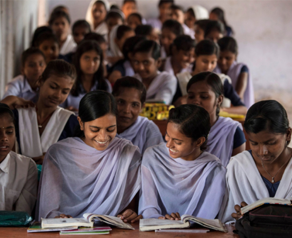 A classroom of South Asian girls reading. Photo credit: Images of Empowerment