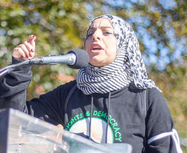 An activist speaking at green new deal network protest. credit: Zayn-Thiam