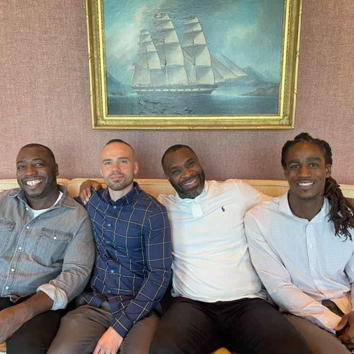 Armand Coleman (third from left), Executive Director of the Transformational Prison Project, a fiscally sponsored project of Tides Center, with three men from the program's leadership team.