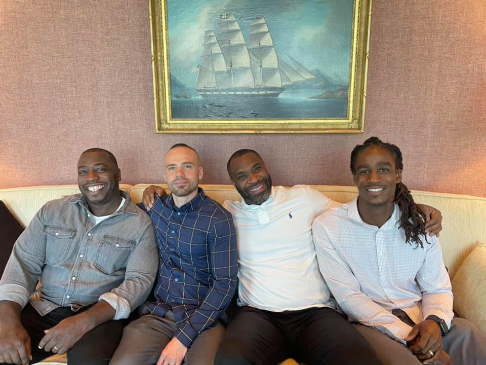 Armand Coleman (third from left), Executive Director of the Transformational Prison Project, a fiscally sponsored project of Tides Center, with three men from the program's leadership team. 