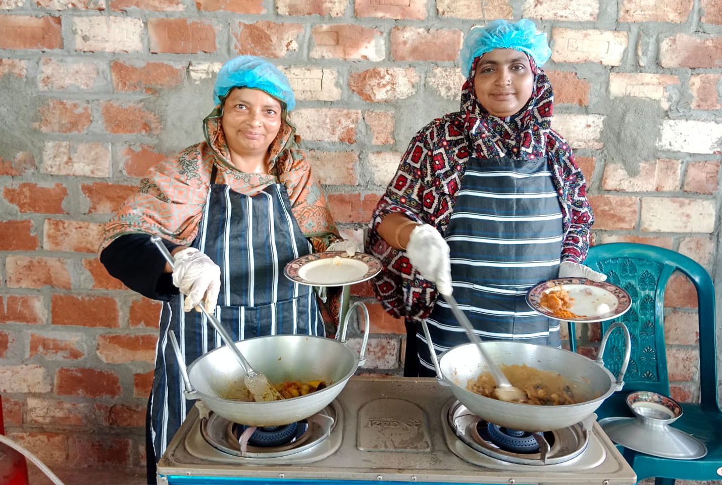 Two women preparing pickles